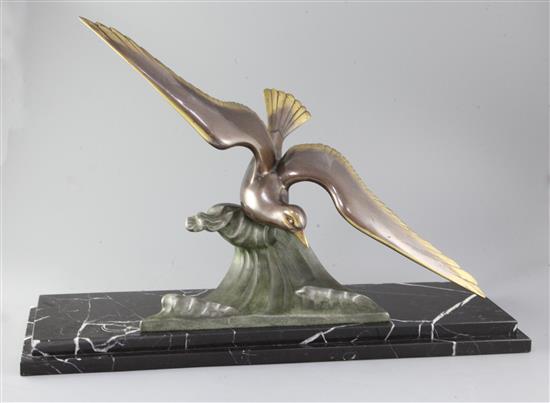 A. De Loury. An Art Deco bronze model of a seagull swooping above a wave, 27in.